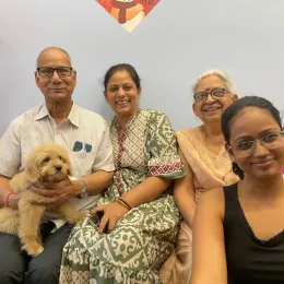 A Curious Tails customer with their new puppy in Singapore