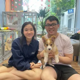 A Curious Tails customer with their new puppy in Singapore