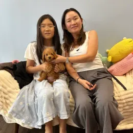 A Curious Tails customer with their new puppy in Singapore