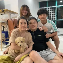 A Curious Tails customer with their new puppy in Singapore
